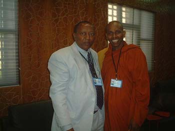 August 2007 in Libya with former prime minister of Tanzania.jpg